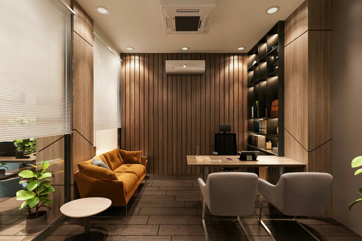 Executive cabin furniture with L-desk, bookshelf, and visitor chairs in corporate office